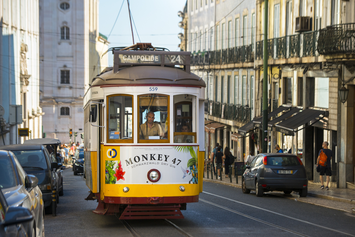 An old worker in a modern city
