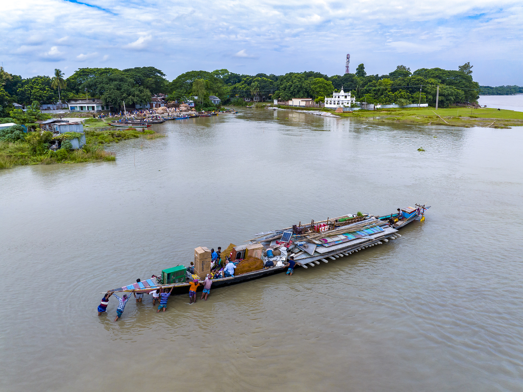 Shifting House by Water Vessel