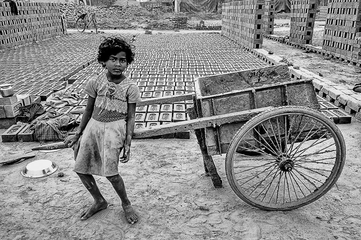 Child Sitting in a Push Cart1400