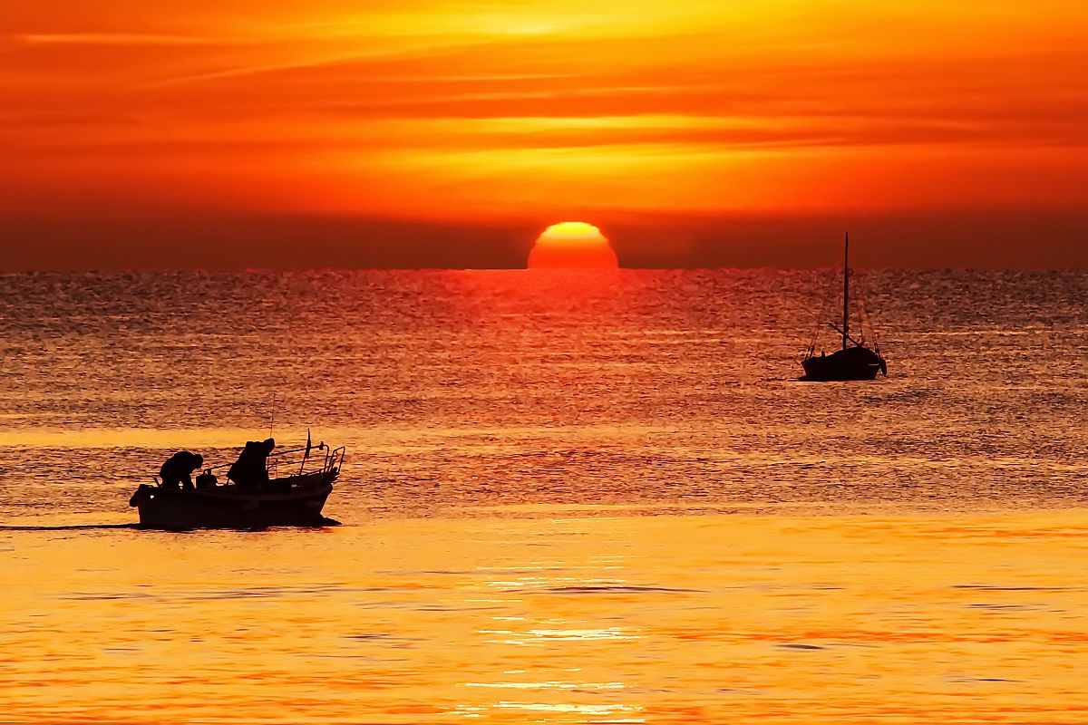 Sunset with fishermen