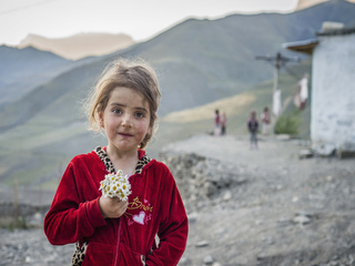 Portrait of a girl with daisies in Khinalig, the highest village of Azerbaijan