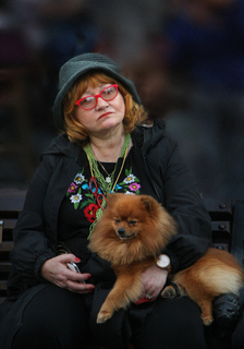 Golden lady with a red dog