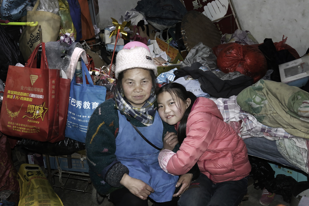 In this single parent family, the mother loves her daughter, and her daughter helps her mother with her work. They are dependent on each other