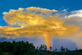 Rainbow Through Clouds
