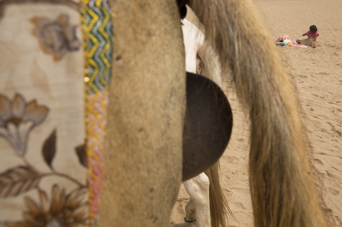  KID PLAYING WITH BEACH SAND