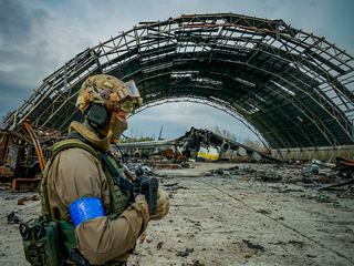 A ukrainian soldier makes a patrol in the Gostomel airport.