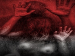 Through the dim glass