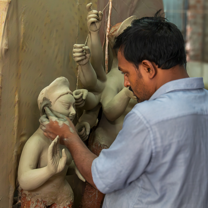 Stage 3 - Applying mud and paste and shaping the idols with hand