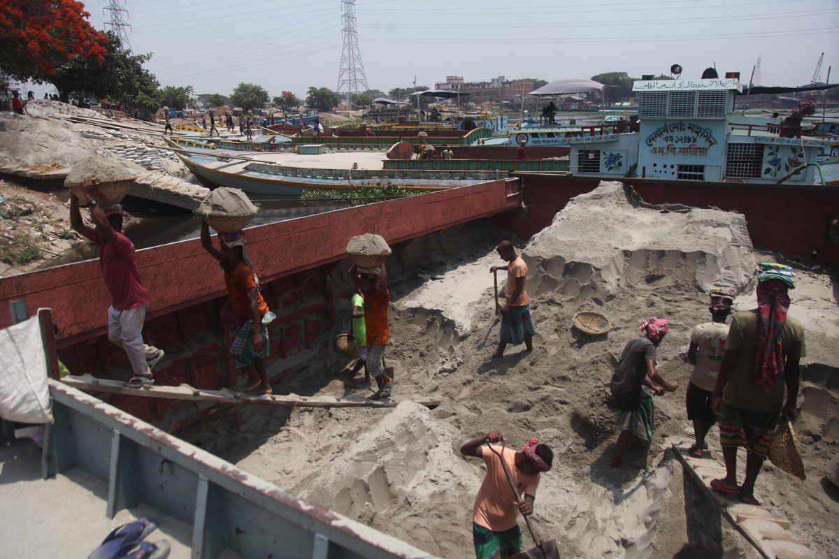 workers unload building materials